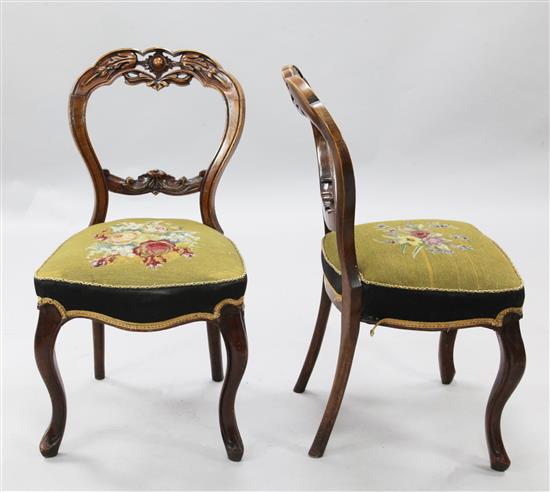 A set of six Victorian carved mahogany dining chairs,